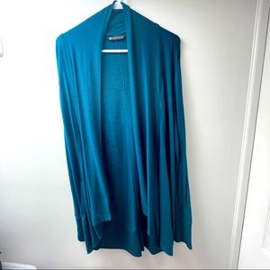 Beautiful, long Athleta wrap includes deep pockets, thumb holes. Like new!